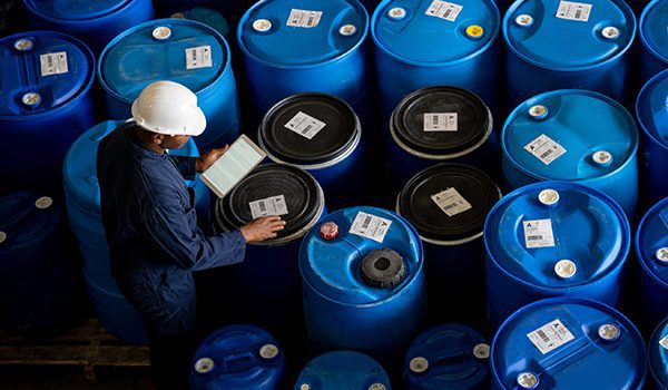 EHS employee focusing on hazardous waste