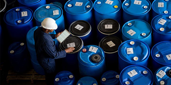 EHS employee focusing on hazardous waste